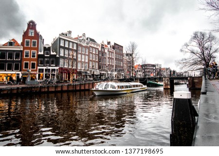 Similar – Image, Stock Photo Tranquil Amsterdam canal with iconic narrow houses