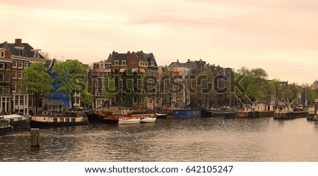 Similar – Image, Stock Photo Tranquil Amsterdam canal with iconic narrow houses