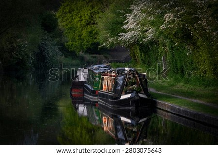 Canal boat reflection springtime  stilness