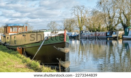 Canal boats moored near Patch Bridge on the Gloucester - Sharpness Ship Canal, United Kingdom