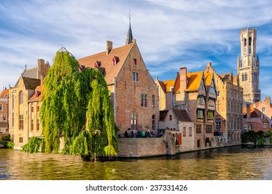 Canal in Bruges with the famous Belfry tower on the background. - Powered by Shutterstock