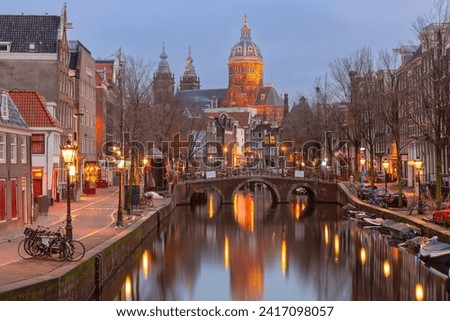 Canal De Wallen, famous red-light district in the twilight, Amsterdam, Holland, Netherlands.