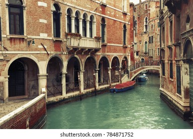 Canal With Gondolas In Venice, Italy. Venice In Winter Time. Vintage Filter Applied. Polaroid Filter Toned.