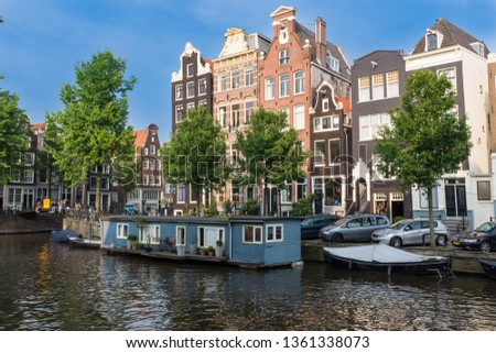 Similar – Foto Bild Architektur niederländischer Häuser und Hausboote am Amsterdamer Kanal