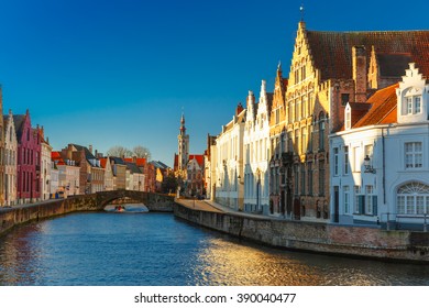 Canal Spiegelrei, Bridge And Tourist Boat In The Sunny Winter Morning In Bruges, Golden Hour, Belgium