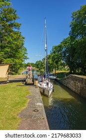 Göta Canal, Sweden, July, 2017, Man Pulling His Boat At A Lock