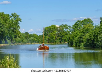 Göta Canal, Sweden, July, 2017, Wooden Boat On A Canal With Lush Trees