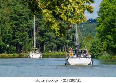 Göta Canal, Sweden, June, 2017, Sailboats In A Lush Canal In The Summer