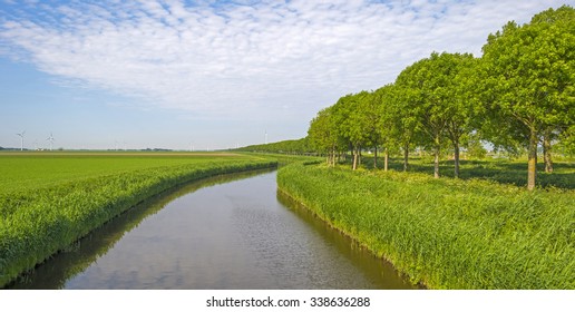 Canal through a rural landscape in spring - Shutterstock ID 338636288