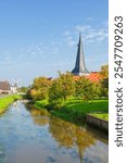 Canal through the village of Jork, Altes Land region, Lower Saxony, Germany