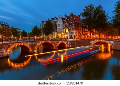 Canals in Amsterdam at night - Powered by Shutterstock