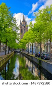 The canals and waterways in the city of Delft in The Netherlands on a sunny day.