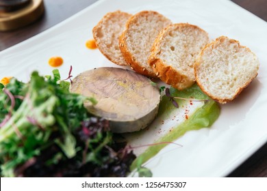 Canape With Foie Gras Pate And Salad Served With White Wine.