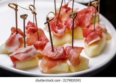 Canapes With Jamon And Juicy Pineapple. The Concept Of Restaurant Service.