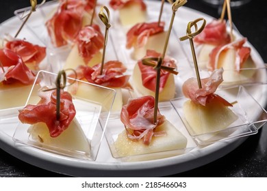 Canapes With Jamon And Juicy Pineapple. The Concept Of Restaurant Service.