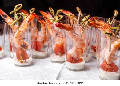 Canapes With Tomatoes, Shrimp And Buttercream On A Large Plate. The Concept Of Restaurant Service.