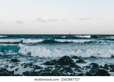 Canary Island, Tenerife-December14,2023.Men and girl professional surfer standing on the sandy beach with his kite and board. Windsurfing, Extreme Sport. High quality photo - Powered by Shutterstock