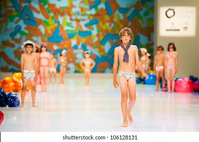 CANARY ISLANDS -JUNE 22: Unidentified models walks the runway in Delia Miranda Baby collection during Gran Canaria Moda Calida swimwear fashion show on June 22, 2012 in Canary Islands, Spain