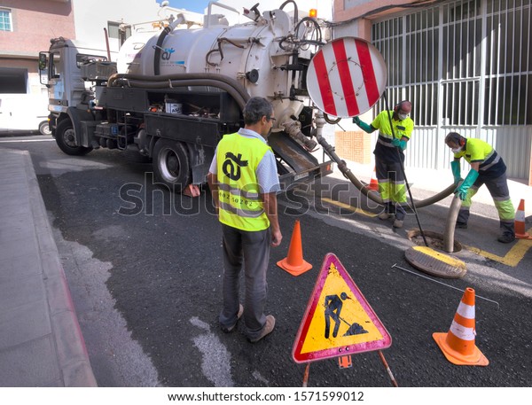 Canary islands, Spain - november 14, 2013: Water\
duct cleaning equipment in the streets of a town on the island of\
Gran Canaria