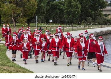 CANBERRA, ACT, AUSTRALIA - 1 DECEMBER 2013: Hundreds Of People In Santa Suits Walk In Canberra, Australia's Capital City, On Sunday 1 December, To Raise Funds For Needy And Disadvantaged Children