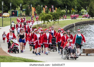 CANBERRA, ACT, AUSTRALIA - 1 DECEMBER 2013: Hundreds Of People In Santa Suits Walk In Canberra, Australia'Â?Â?s Capital City, On Sunday 1 December, To Raise Funds For Needy And Disadvantaged Children