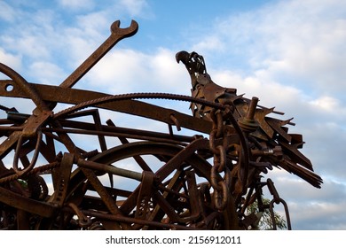 CANBERRA, AUSTRALIA - Jul 06, 2021: The detail of a rusty steel modern sculpture showing a spanner and a bird in Canberra, Australia