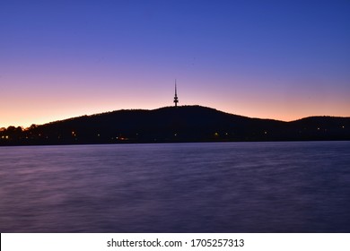 Canberra, Australia - July 9, 2019: Testra tower is located on the top of Black Mountain, Canberra, ACT, before the sunset.