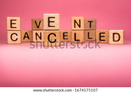 Cancel word on wooden cubes. Cancelled word made with building blocks. Mass gathering cancelled. Repatriation and quarantine of travellers. Travel advice. Protect from coronavirus infection
