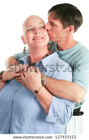 Cancer patient supported by her loving husband.  White background