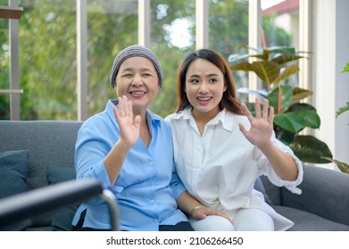 A Cancer Patient Woman Wearing Head Scarf With Her Supportive Daughter Making Video Call On Social Network With Family And Friends In Hospital, Head Shot Close Up Portrait.