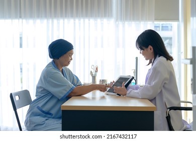 Cancer Patient Woman Wearing Head Scarf After Chemotherapy Consulting And Visiting Doctor In Hospital..	
