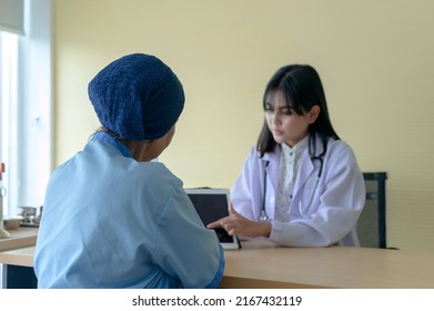 Cancer Patient Woman Wearing Head Scarf After Chemotherapy Consulting And Visiting Doctor In Hospital..	
