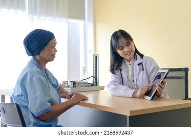 Cancer Patient Woman Wearing Head Scarf After Chemotherapy Consulting And Visiting Doctor In Hospital..	
