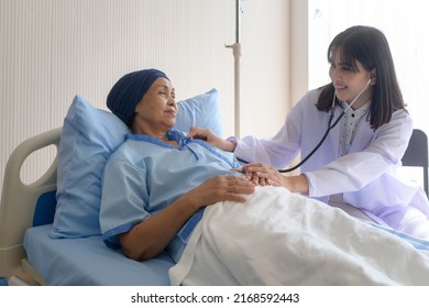 Cancer Patient Woman Wearing Head Scarf After Chemotherapy Consulting And Visiting Doctor In Hospital..	
