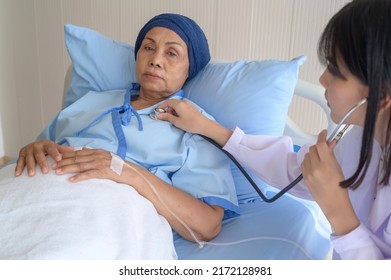 Cancer Patient Woman Wearing Head Scarf After Chemotherapy Consulting And Visiting Doctor In Hospital..	
