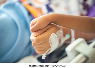 Cancer Patients Are Encouraged By Family Members With Joyful Handshaking In A Hospital.