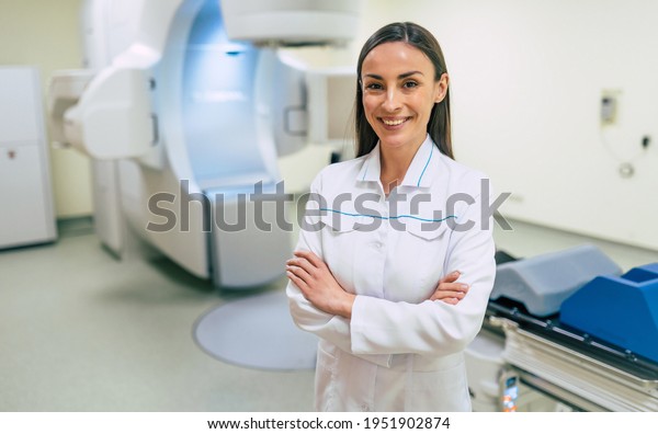 Cancer\
treatment in a modern medical private clinic or hospital with a\
linear accelerator. Professional doctors team working while the\
woman is undergoing radiation therapy for\
cancer