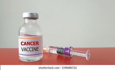 Cancer vaccine bottle and syringe for injection. It either treatment or prevention cancer. Therapeutic vaccine is Immunotherapy.  Oncology treatment and medical technology concept 