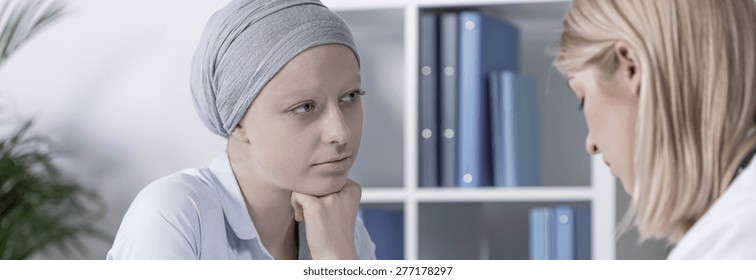 Cancer Woman Wearing Scarf During Medical Consultation