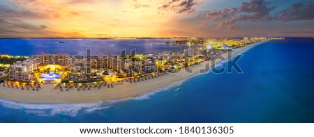 Cancun beach with orange sunset