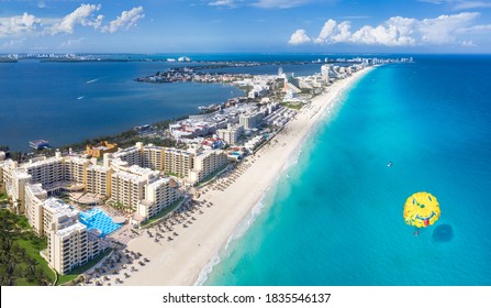 Cancun Beach With Para Sailing Over Water