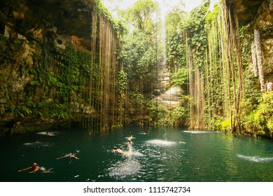Cancun, Mexico - October 10 2007: People are swimming and diving in the Cenotes in Mayan jungle.