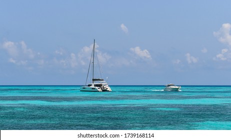 Cancun, Quintana Roo / Mexico. February 15, 2019: Catamaran And Yacht Sailing In The Turquoise Waters Of Cancun 