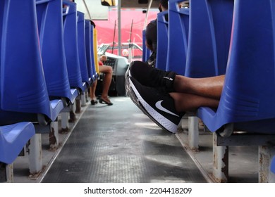 Cancun, Quintana Roo, Mexico; January 2021: Walking Along The Coastal Strip Of Cacun On Public Transport, A Young Man Wears Black Nike Sports Shoes