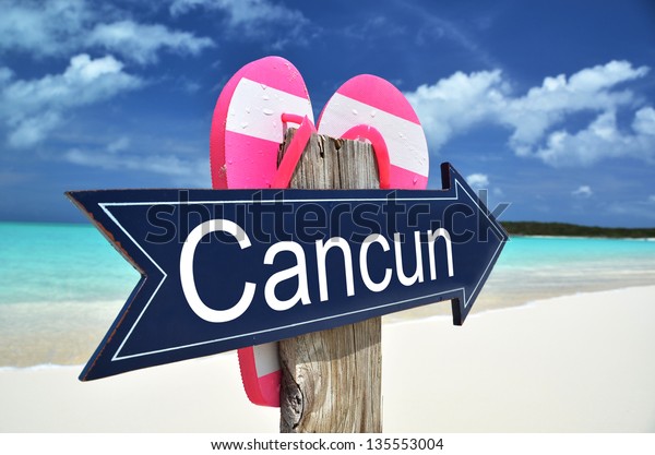 cancun sign on beach