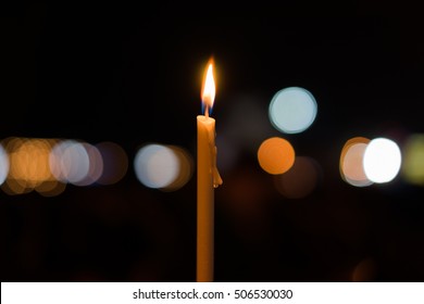 A candels with background of dark and bokeh. - Powered by Shutterstock