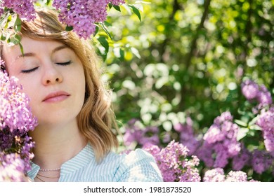 Candid Authentic Portrait Of 30s 40s Caucasian Blonde Woman With Lilac Flowers. 30 40 Year Old Woman Enjoying Life In Lilac Flowers Nature Background. Reinvention, Life Changes, Reinvent Yourself