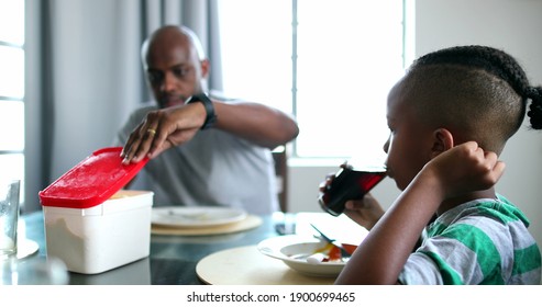 Candid Black African Family Eating Lunch, Dad Putting Away Phone, Child Drinking Soda Beverage