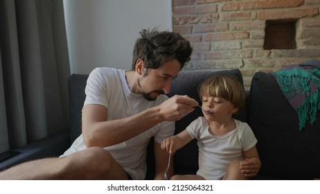 Candid Family Moment Father Feeds Toddler Child Yogurt Breakfast In Morning