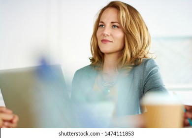 Candid Image Of Succesful Business Woman Caught In An Animated Brainstorming Meeting